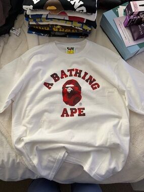 A Bathing Ape White Graphic Crewneck with Red Camo Logo